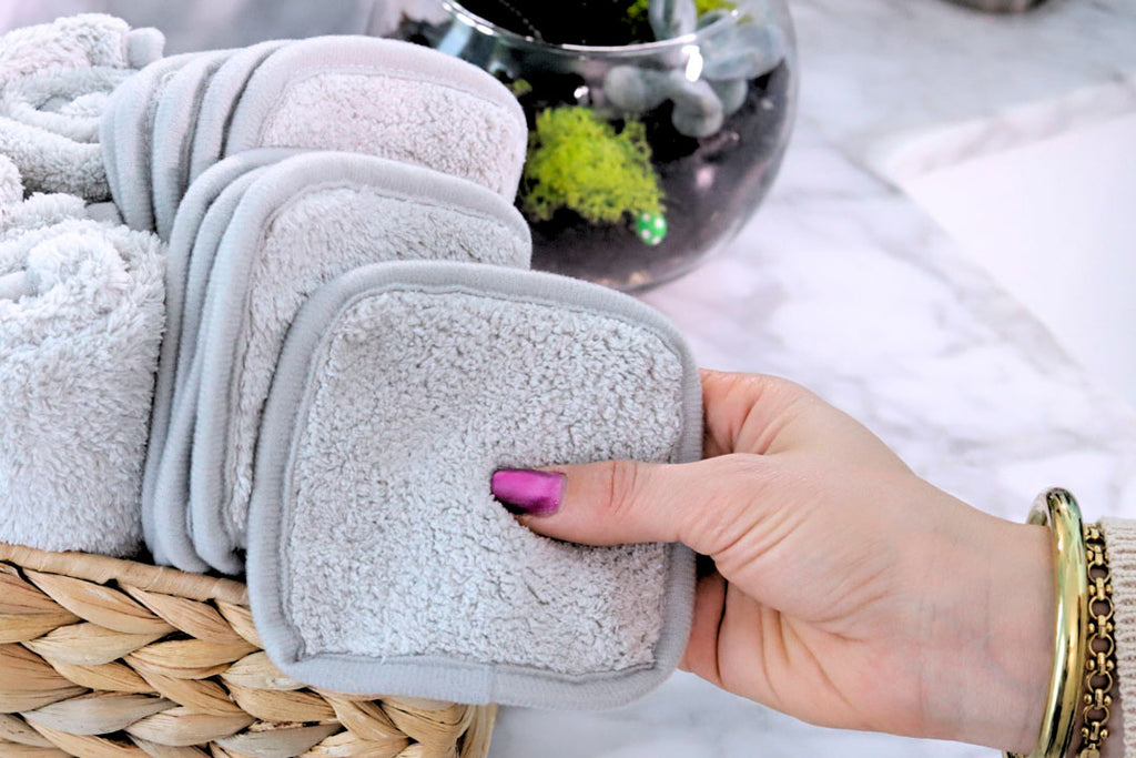 hand holding a reusable eye makeup remover pad