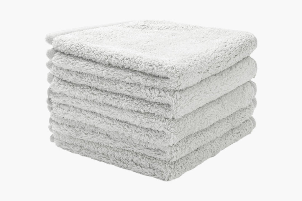 five grey luxury face cloths